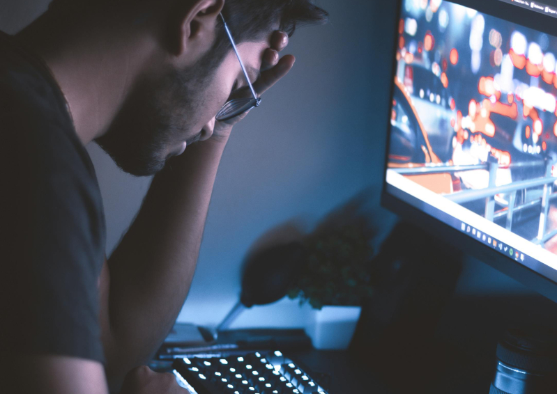 Tired man at computer