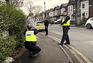 Isabel Vaughan-Spruce being searched during arrest for praying silently outside an abortion facility. 