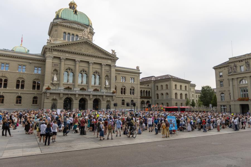 1,000 remember the persecuted at Switzerland protest:  mass grave, wooden crosses and survivors’ stories