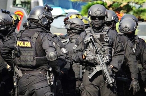 A team from Densus 88, an elite counter-terrorism force, prior to an operation in Indonesia. 