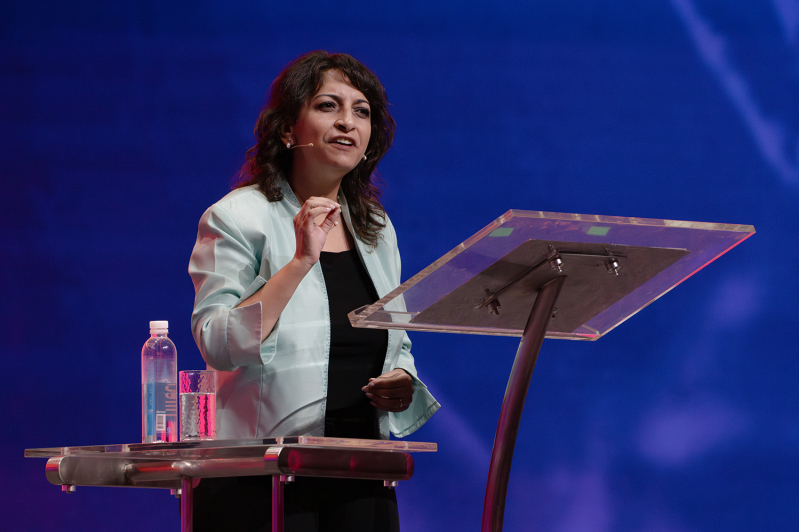 Anne E. Zaki speaking to delegates about unity in the church and the importance of honest discussions during a plenary session at Lausanne 4