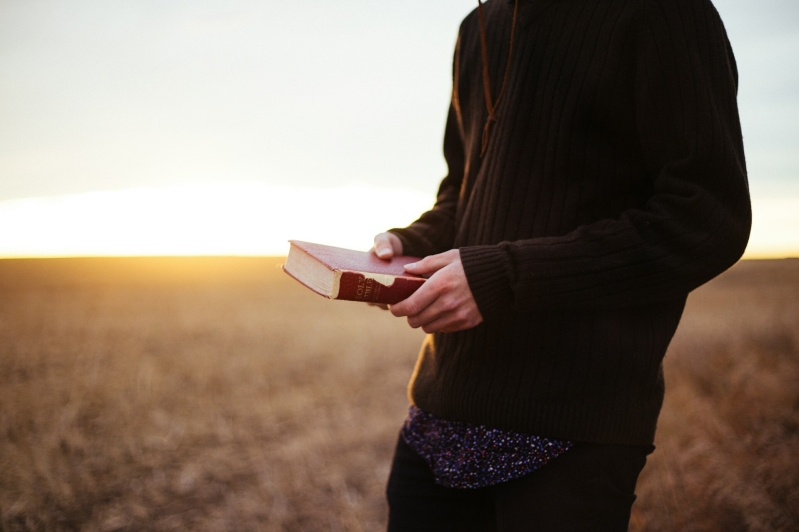 holding Bible