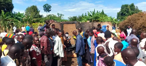 Villagers at charred home where Pastor Mukisa and family were burned to death in Namutumba District, Uganda on Oct. 13, 2024. 