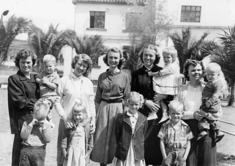 The five wives and seven children of the missionaries.