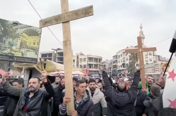 Protests erupted in Syria following the burning of a Christmas tree; Christians cautiously hopeful recognizing long road ahead