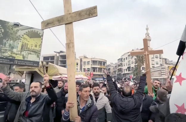 Protests erupted in Syria following the burning of a Christmas tree; Christians cautiously hopeful recognizing long road ahead